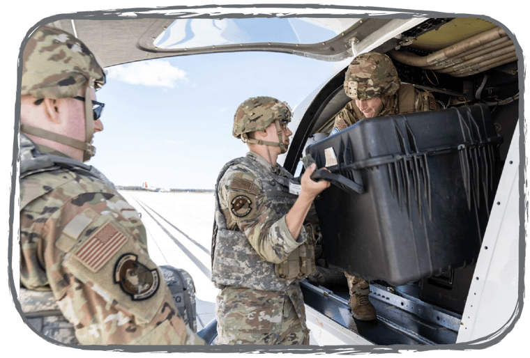 A military team member loading cargo into ALIA